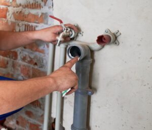 Photo of a plumbing inspection – pipes should be among the many items on a seasonal checklist.